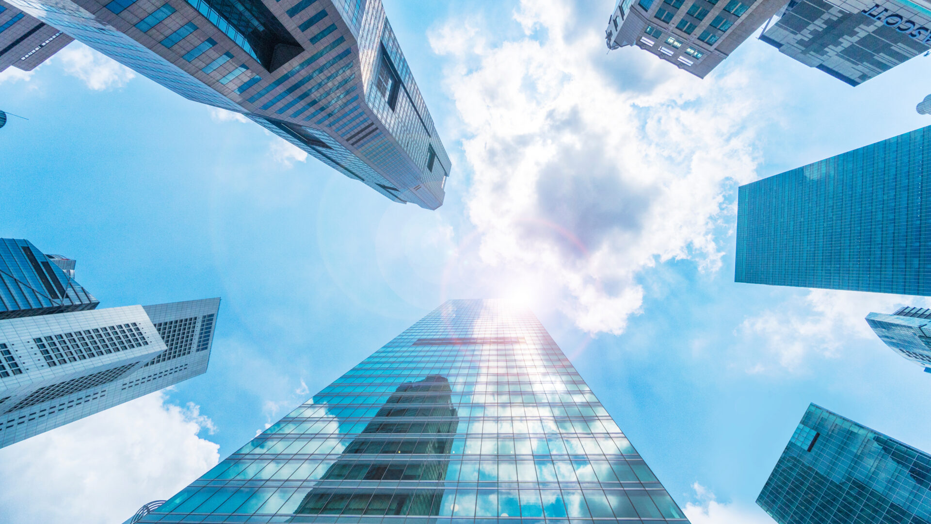 A view of the sky from below looking up at some buildings